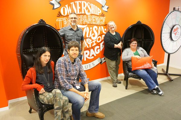 Discovery USA Team Photo With Their Wall Graphics Installation