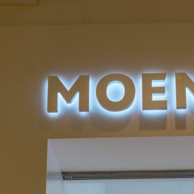 Close Up of Backlit Moen Signage