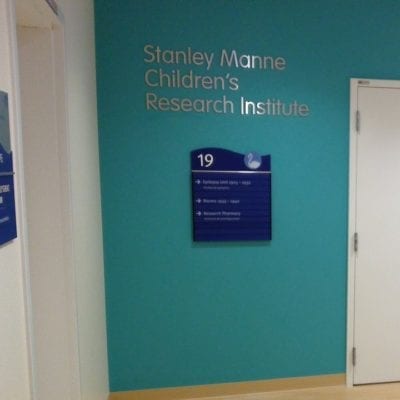 Interior Directional Signage in Hospital Hallway