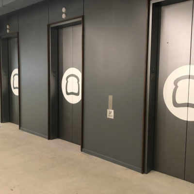 Decals on Elevators at Toast Office