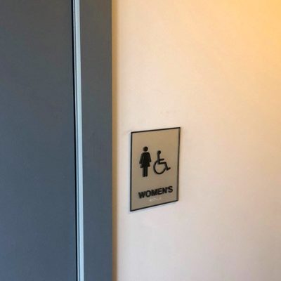 Side View of Braille Restroom Sign at Lake Meadows Apartments.